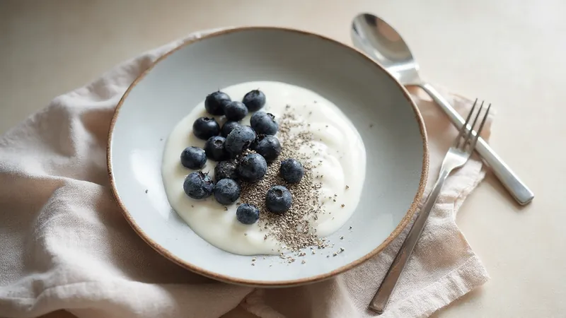 Soy yoghurt with chia and blueberries: Soy yoghurt, Blueberries, Chia seeds. Generated illustration.