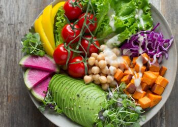 Best anti-inflammatory foods arranged on a table including colorful fruits vegetables and healthy ingredients