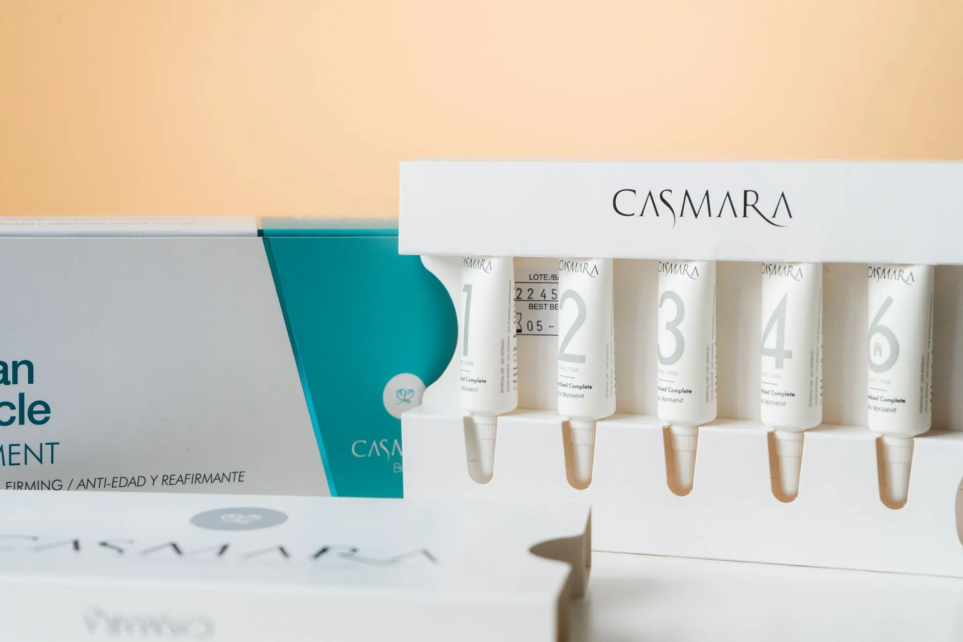 Elegant display of Casmara beauty products with skincare serums in a clean, modern setup