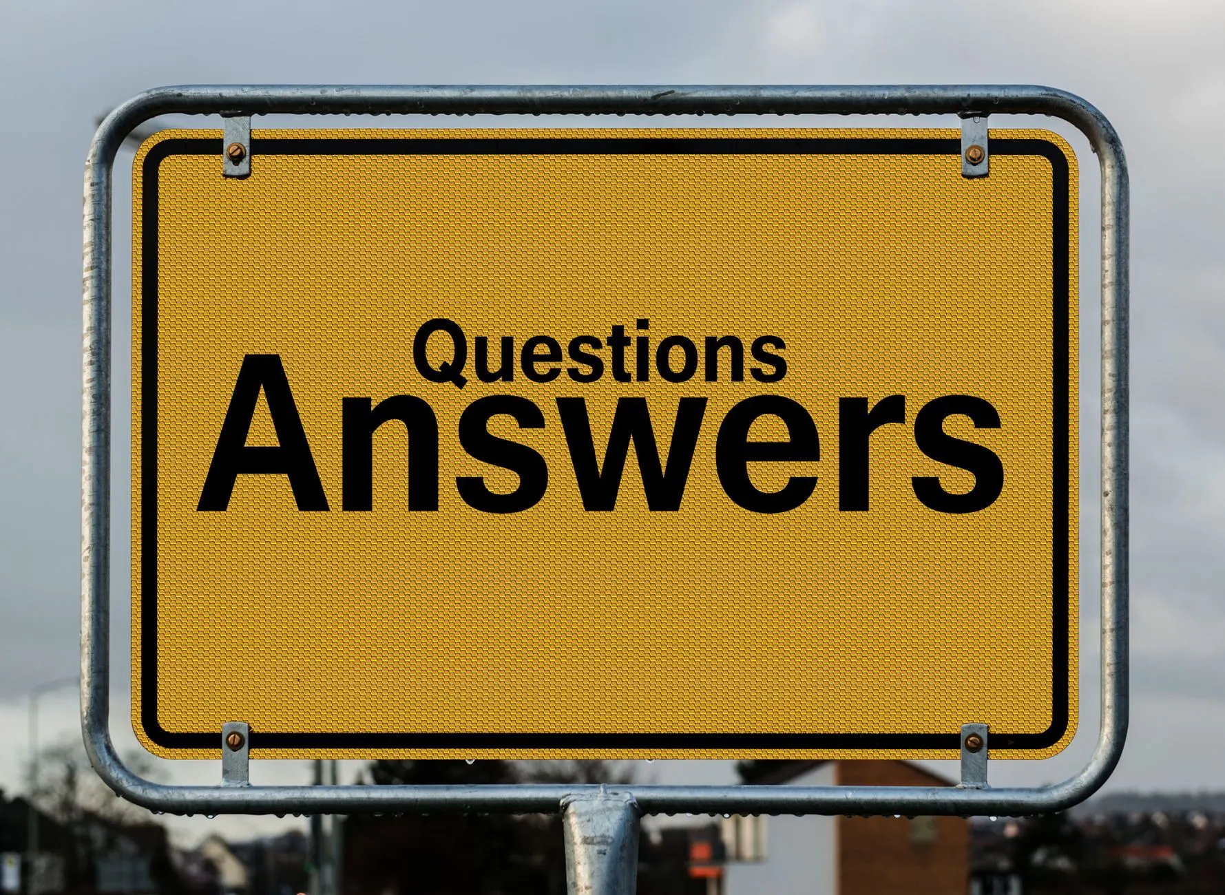 Yellow sign with text questions and answers suggesting direction in decision-making