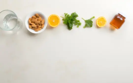 Seen from directly above on a pale stone worktop, the objects spread evenly across the whole frame: a glass of water, a , generated illustration